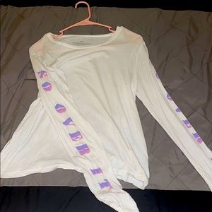 White top with “so over it” written on the sleeves